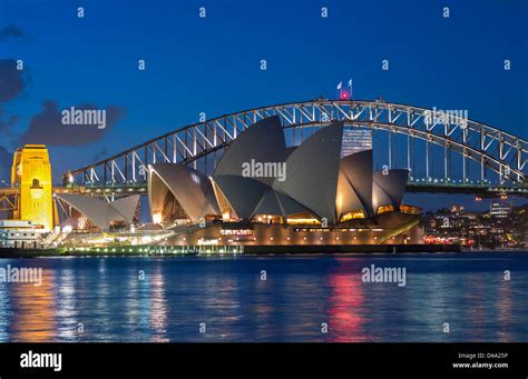 View Sydney Opera House And Harbour Bridge At Night In Australia Stock