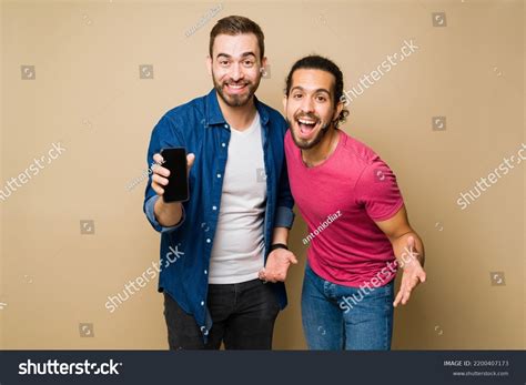 Attractive Excited Gay Couple Laughing While Stock Photo