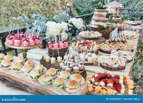 Table Decorated with Desserts, Snacks and Cake - Wedding Reception for ...