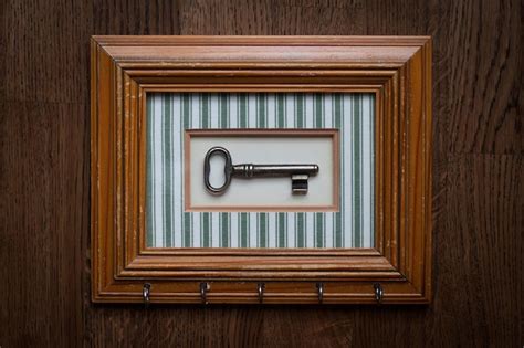 Premium Photo | Vintage key holder with wooden frame