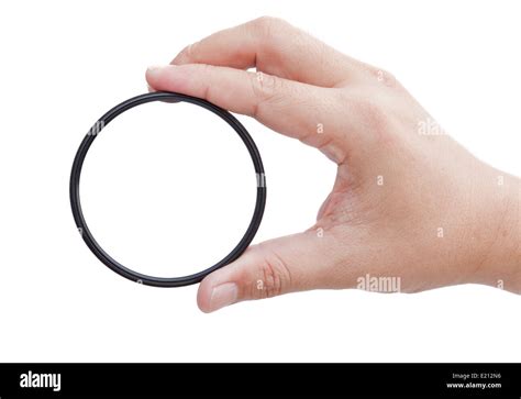 Hand holding clear camera filter Stock Photo - Alamy