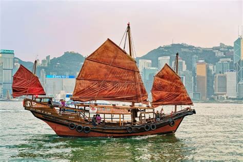 Junk Boat At Victoria Harbor In Hong Kong At Sunset Editorial Photo