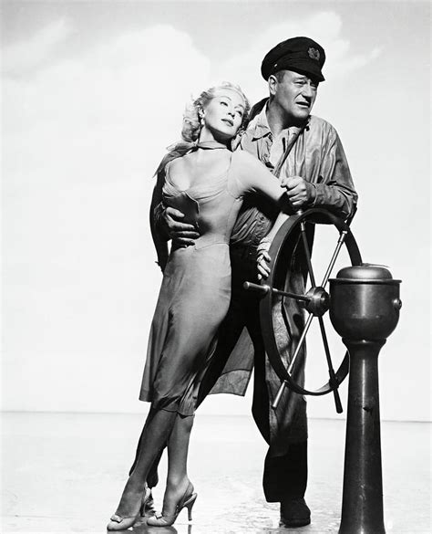 JOHN WAYNE and LANA TURNER in THE SEA CHASE -1955-. Photograph by Album - Pixels