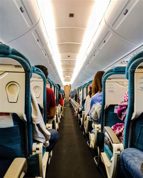 Premium Photo Passengers Sitting On Seat In Airplane