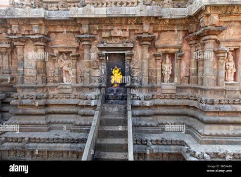 Stairs Leading To An Alcove With Hindu Deity Statue Wrapped In Bright