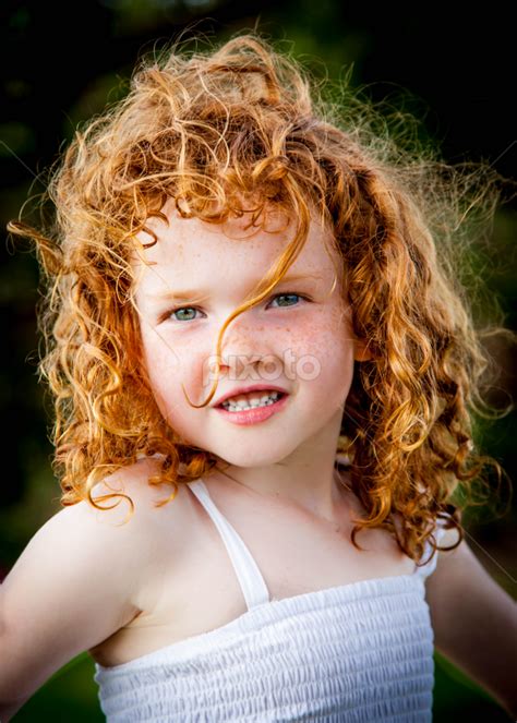 Cute Baby Girl With Green Eyes And Curly Hair