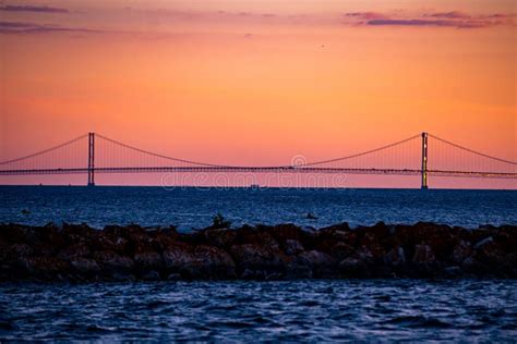 Mackinac Bridge at sunset stock image. Image of dawn - 256892037