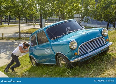 Man Pushing His Car Stock Photo - Image: 57324497