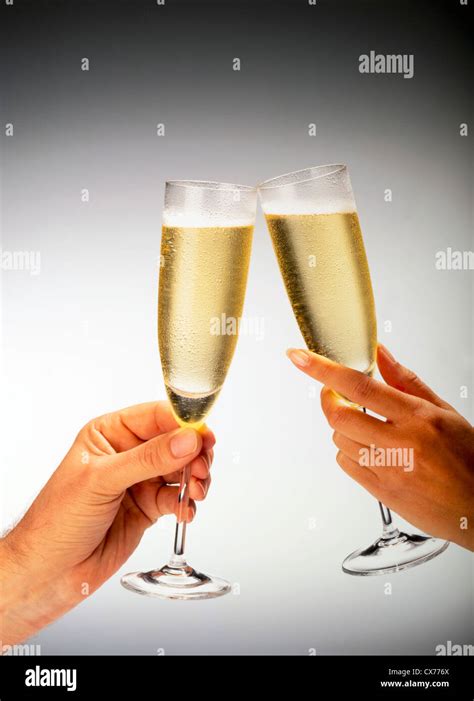 MAN AND WOMAN TOASTING WITH CHAMPAGNE GLASSES Stock Photo Alamy