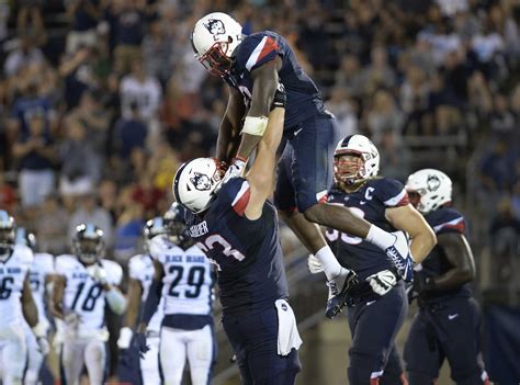 Photos: UConn football defeats Maine