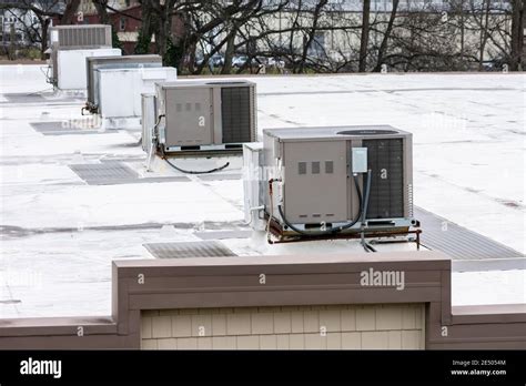 Horizontal Shot Of A Row Of Rooftop Air Conditioning Units On Top Of A