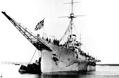 An Old Photo Of A Ship In The Water With People Standing On It S Side