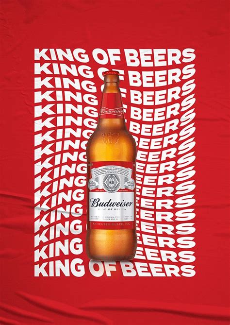 A Bottle Of Beer Sitting On Top Of A Red Tablecloth With White