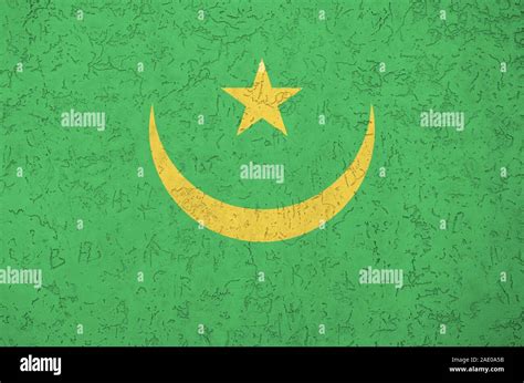 Mauritania Flag Depicted In Bright Paint Colors On Old Relief