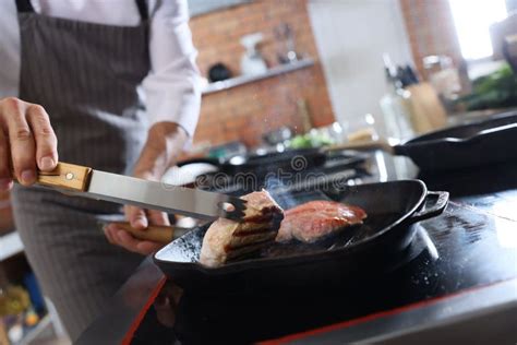 Professional Chef Cooking Meat on Stove in Restaurant Kitchen Stock ...