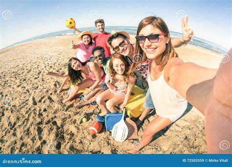 Group Of Multiracial Happy Friends Taking Fun Selfie At Beach Stock