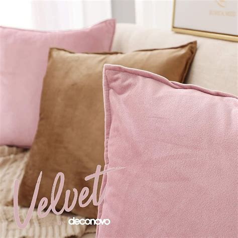 A Close Up Of Pillows On A Couch With The Words Velvet Above Them In