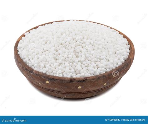 White Sago Pearls Or Tapioca Pearl In Wooden Spoon Top View Selective