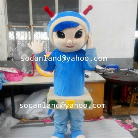 the mascot is wearing blue clothes and holding his hands up in front of his face