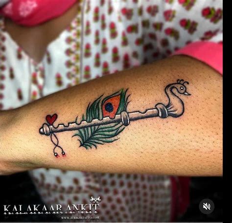 Krishna Flute With Peacock Feather Tattoo