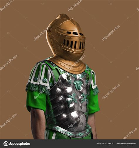 Handsome Guy Dressed In Roman Armor And Knight Helmet Stock Photo