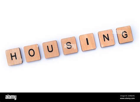 The Word Housing Spelt With Wooden Letter Tiles Stock Photo Alamy