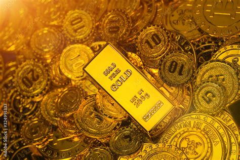 Gold bars in gold coins Stock Photo | Adobe Stock