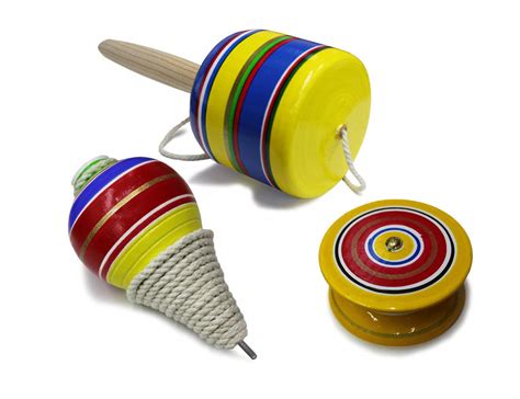 Mexican Toys From Wooden Balero Yoyo And Trompo In Mexico On A Yellow