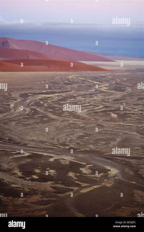 Sunrise in the Sossusvlei sand dunes in the Namib desert Namibia Africa ...