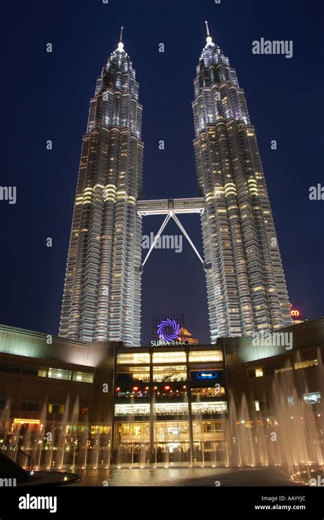 Petronas Twin Towers And Entrance To The Suria Shopping Centre At Night