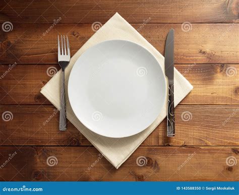 Plate, Knife and Fork on Napkin Cloth Stock Photo - Image of empty, lunch: 143588350