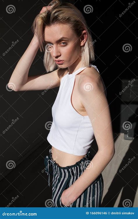 Beautiful Fashionable Blonde Woman In Trendy Portrait Clothing Stock