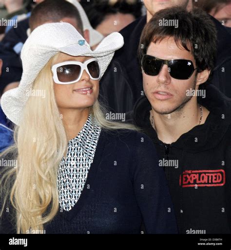 (dpa) - The picture shows Paris Hilton and her fiance Paris Latsis in the crowd during the Live ...