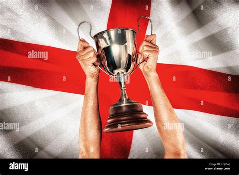 Composite Image Of Portrait Of Smiling Rugby Player Holding Trophy