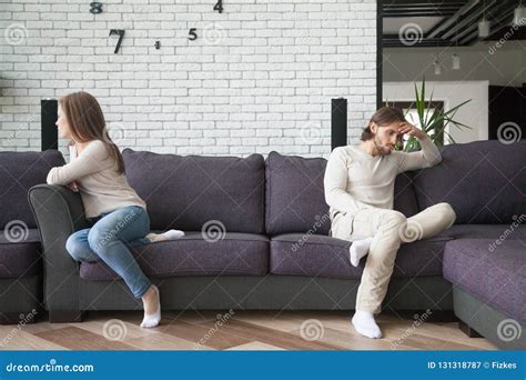 Unhappy Married Couple In Quarrel Sitting On Couch Stock Image Image