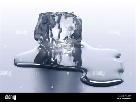 Melting Ice Cube With Melted Water Stock Photo Alamy