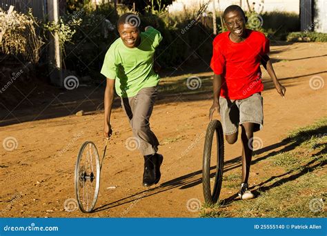 Teenage Boys Playing With Wheel Stock Photo 25555140