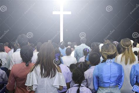 Christians Raising Their Hands In Praise And Worship At A Night Music