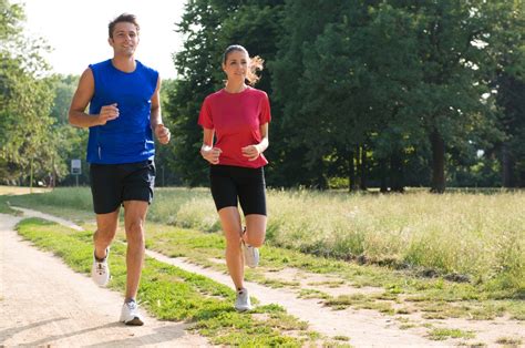 Portrait Of Young Man And Woman Jogging Together Cau