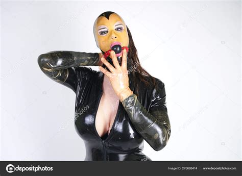 Hot Curvy Crossdresser Wearing Latex Rubber Mask Black Fetish Costume