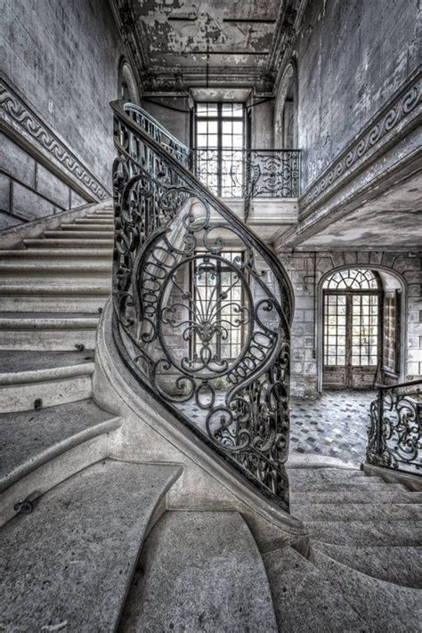 A Spiral Staircase In An Old Building