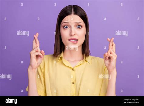 Photo Of Young Girl Bite Lips Teeth Fear Crossed Fingers Pleading Wish