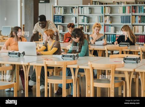 Multiethnic Students Doing Homework In Modern Library Stock Photo Alamy