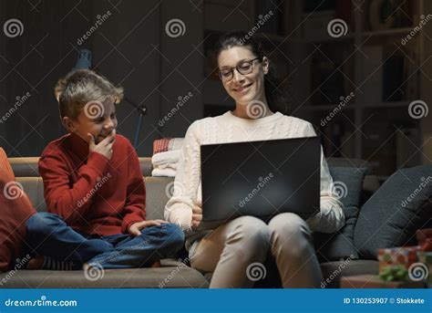 Mother And Son Watching Movies On A Laptop Stock Image Image Of