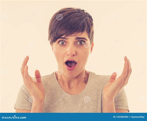 Portrait Of Young Attractive Woman Looking Scared And Shocked Covering Her Face In Fear Stock