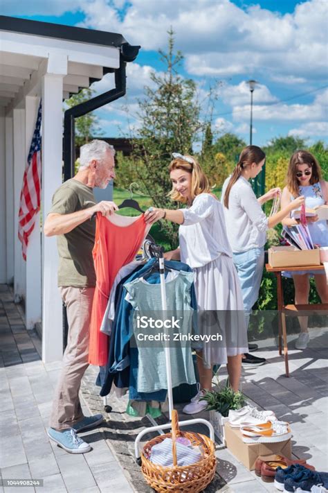 Stylish Wife Wearing Baggy Summer Dress Looking At New Red Dress At
