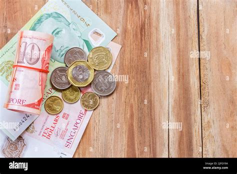 Singapore Money On Wooden Table Background Various Of Singapore Dollar