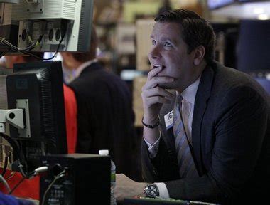 Dow Jones falls sharply as JP Morgan reports $9 billion loss ...