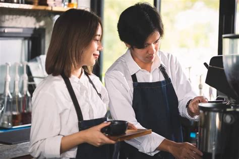 Two Asian Coffee Waitress Making Cup Hot Coffee Latte Coffee Stock