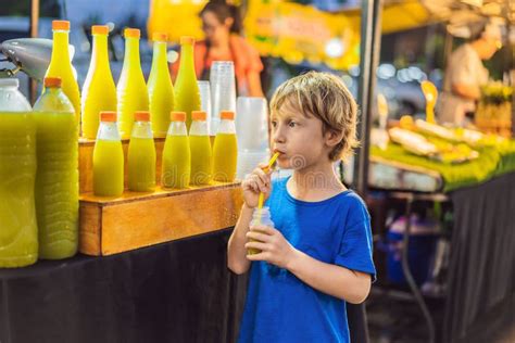 Boy Drinking Sugar Cane Juice On The Asian Market Stock Photo Image